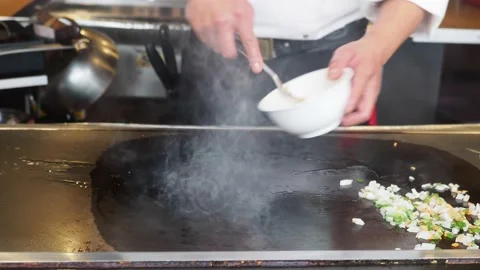 Teppanyaki Chef, Cooking Egg Fried Rice At A Restaurant, London, UK Stock Footage 154353255