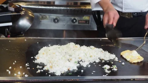 Teppanyaki Chef, Cooking Egg Fried Rice At A Restaurant, London, UK Stock-Footage 154353288