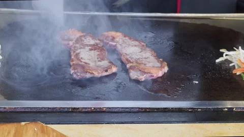 Teppanyaki Chef, Flame Cooking Two Luxurious Wagyu Steaks, London, UK Stock-Footage 154353095