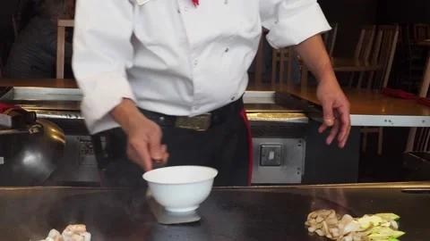 Teppanyaki Chef, Preforming Tricks At A Restaurant, London, UK Stock-Footage 154348913