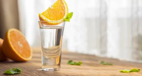 Tequila shot with orange Stock Photos