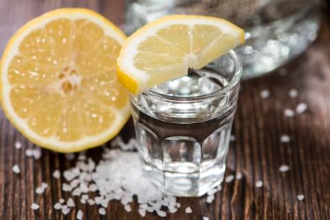 Tequila silver with lemon Stock Photos