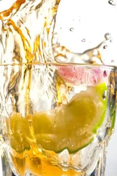 Tequila splash with motion and lime Stock Photos