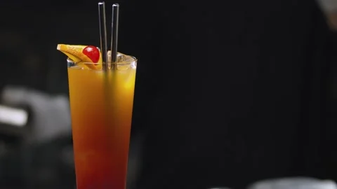 Tequila Sunrise Cocktail rotating on the table Stock Footage 131432893