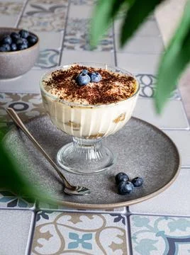 Teramisu on a plate on the kitchen table Fotos Stock