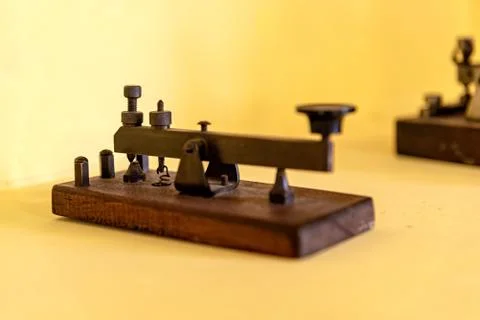 Terminal to make morse code and communicate in that way, on a yellow backgrou Stock Photos