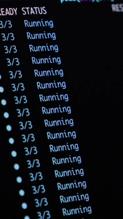 A terminal screen displaying Kubernetes container pod status logs, illustrating Stock Footage 346525725