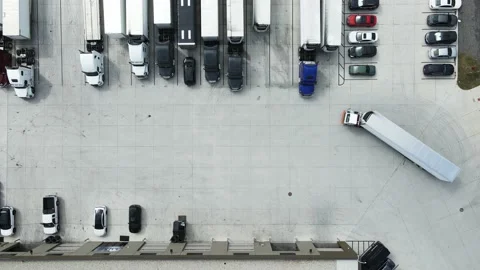 Terminal tractor also known as yard jockeys moving a refrigerator trailer Stock Footage 213872290