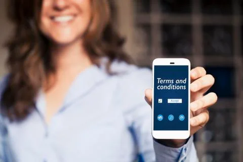 Terms and conditions message in a mobile phone screen. Stock Photos