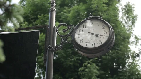 Ternopil old big black clock in the sity park Stock Footage 106813572
