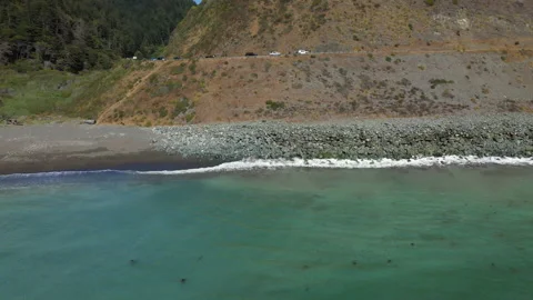 Terquoise ocean waves crashing - backwards flight Stock Footage 152789633