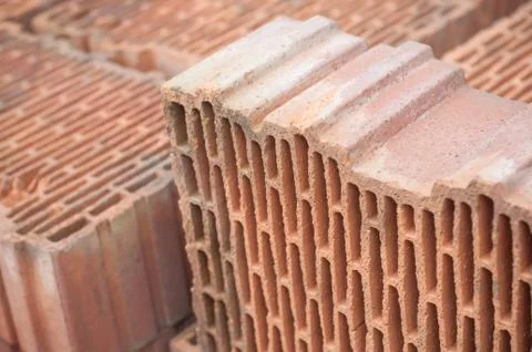 Terra cotta bricks pile in construction site Stock Photos