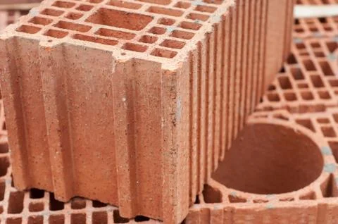 Terra cotta bricks pile in construction site Stock Photos