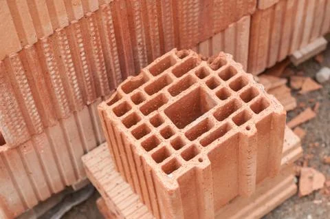 Terra cotta bricks pile in construction site Stock Photos