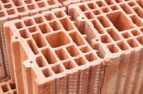 Terra cotta bricks pile in construction site Stock Photos
