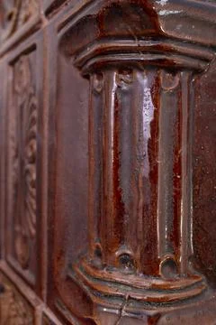 Terra cotta column texture, on a romanian heating stove, soft focus close up, Foto stock
