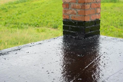 The terrace is covered with a layer of waterproofing mastic Stock Photos