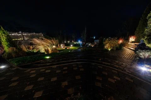 Terraced backyard path with lights and grasses at a private residence Stock Photos