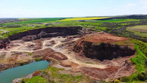 Terraced open pit quarry with mining machinery, Bulgaria Stock Footage 336344004