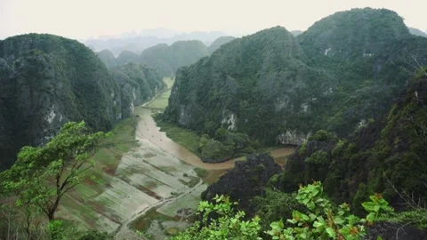 Terraced Rice Fields Spanning a River Valley in Hang Mua, Ninh Binh Stock Footage 340015173