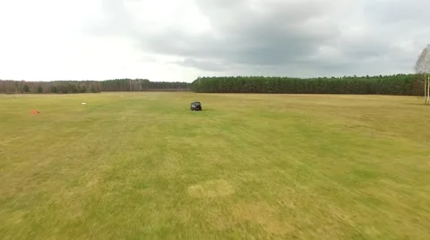 Terrain car driving on a meadow Stock Footage 65583792