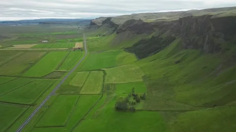 Terrain split in parcels, road crossing through them. 4k, aerial Stock Footage 250309821