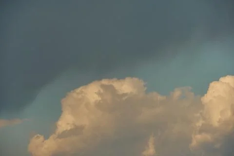 A terrible black cloud hangs in the sky before the rain. Bad weather. Hurrica Stock Photos