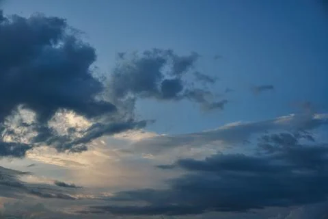 A terrible black cloud hangs in the sky before the rain. Bad weather. Hurrica Stock Photos