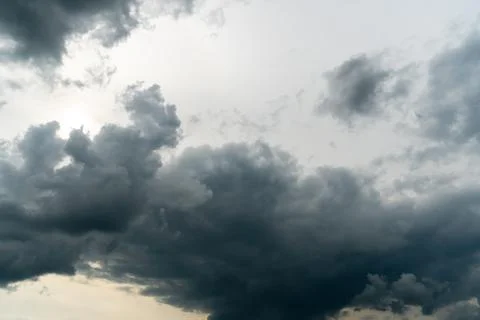 A terrible black cloud hangs in the sky before the rain. Bad weather. Hurrica Stock Photos