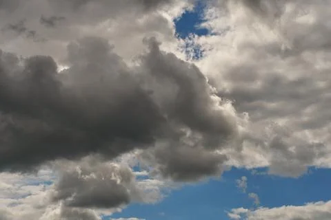 A terrible black cloud hangs in the sky before the rain. Bad weather. Hurrica Stock Photos