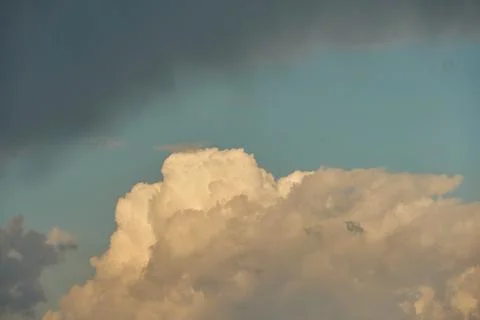 A terrible black cloud hangs in the sky before the rain. Bad weather. Hurrica Stock Photos