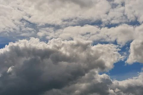 A terrible black cloud hangs in the sky before the rain. Bad weather. Hurrica Stock Photos