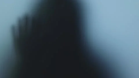 Terrible blurred shadow in the window. Concept of horror, robbers Video stock 225422845