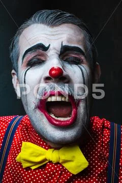 Terrible crazy clown and Halloween theme Stock Photos