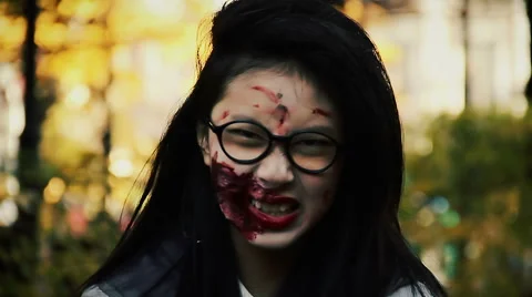 Terrible female zombie looking aggressively into camera, scary bloody vampire Stock Footage 59082721