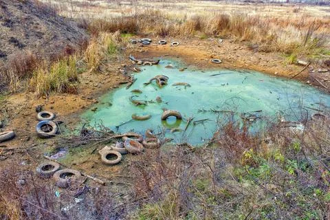 A terrible garbage dump made of dirt and car tires Stock Photos