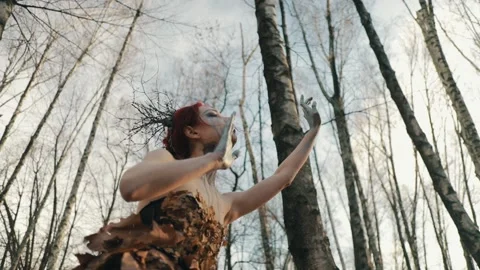A terrible witch in the autumn forest with  Stock Footage 169214294