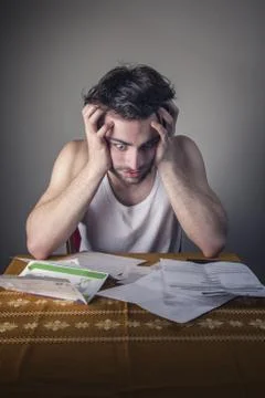 Terrified with bills Stock Photos
