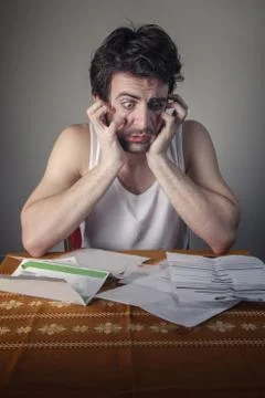 Terrified with bills Stock Photos