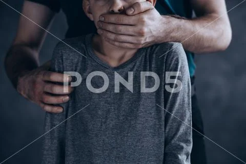 Terrified kidnapped boy Stock Photos