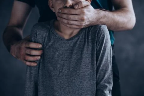 Terrified kidnapped boy Stock-Fotos