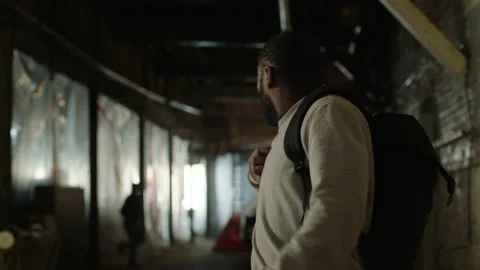 Terrified man with backpack stops for breath before running and being chased in Stock Footage 199460322