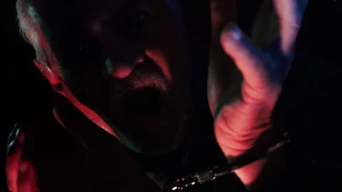 Terrified Man in Handcuffs Panic Face in Darkness 2 Stock Footage 324612460