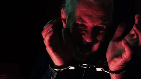 Terrified Man in Handcuffs Panic Face in Darkness 4 Stock Footage 324613103