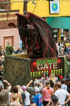 Terrifying Monster Rises Up On Parade Float At Halloween Parade Stock Photos