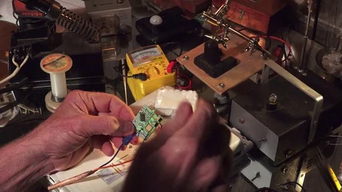 Terrist working Plastic explosive loaded into laptop computer Stock-Footage 74270624