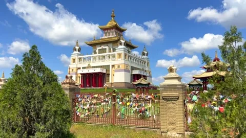 The territory of the Buddhist temple "Golden abode of Buddha Shakyamuni" Stock Footage 243063330