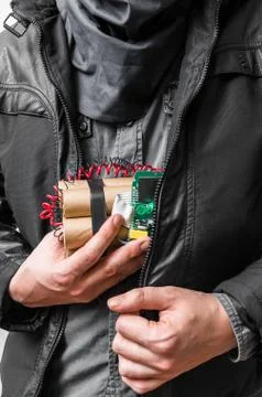Terrorism concept. Terrorist has dynamite bomb in jacket. Foto stock