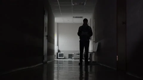 Terrorist about to attack a man in dark corridor Видео 134935870