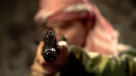 The terrorist with automatic rifle aims in the camera in slow motion Stock-Footage 58216518